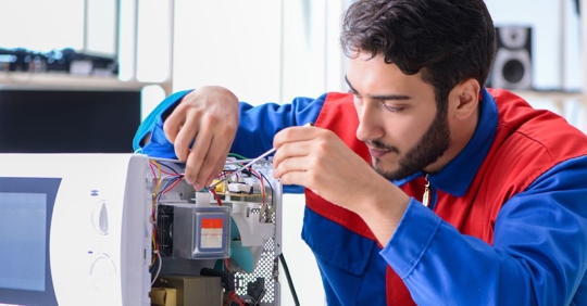 man troubleshooting microwave problem